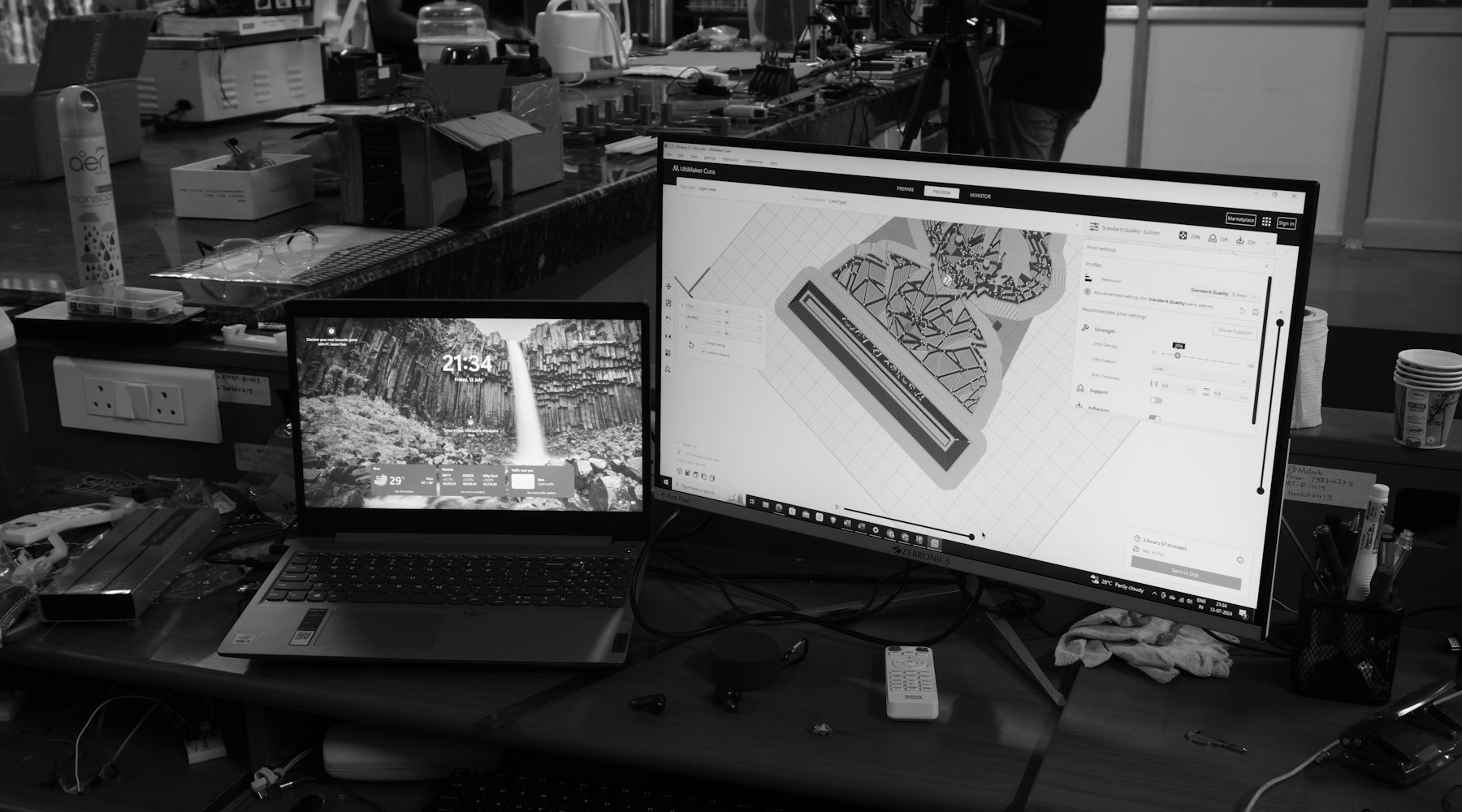 Monochrome workspace with dual monitors and structured desk setup